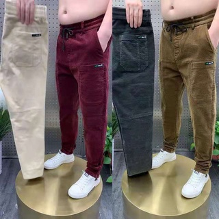 2021 principios de otoño nuevos pantalones casuales de los hombres de la tendencia de pana rayas versátiles2021