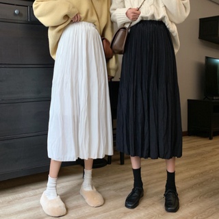 Falda de mujer blanca a principios de la primavera de 2021, el nuevo estilo de longitud media es una falda delgada y de temperamento con una línea de suéter en invierno