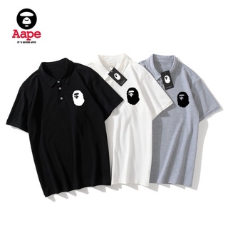 Bape solapa logotipo de manga corta impreso T-Shirt hombres y mujeres Polo camisa