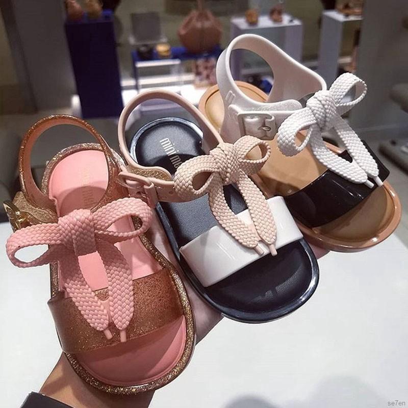 Se7en lindo bebé niñas arco color coincidencia sandalias PVC niñas sandalias