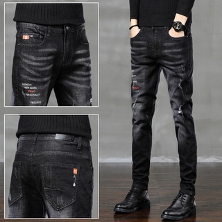Otoño nuevo negro Jeans de los hombres delgados pequeños pies de moda de los hombres Casual elástico pantalones marea marca