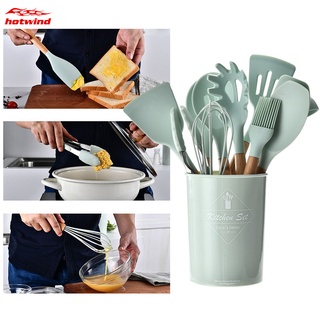 un juego de utensilios de cocina de silicona con mango de madera natural herramientas de cocina (1)