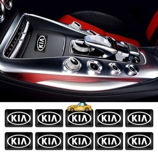 10pcs reposabrazos de coche botón epoxi pegatina auto interior pantalla emblema de la insignia de la insignia para kia ceed borrego carens k2 sedona k7 kx5 riok2